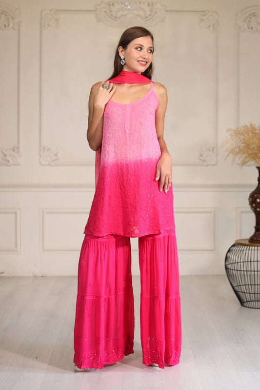 featuring exquisite mukaish work that adds a touch of sparkle to the rich, flowing fabric