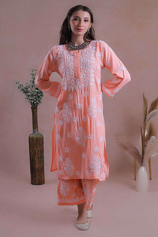 This kurta set classic ensemble adorned with intricate hand-embroidered Chikankari motifs