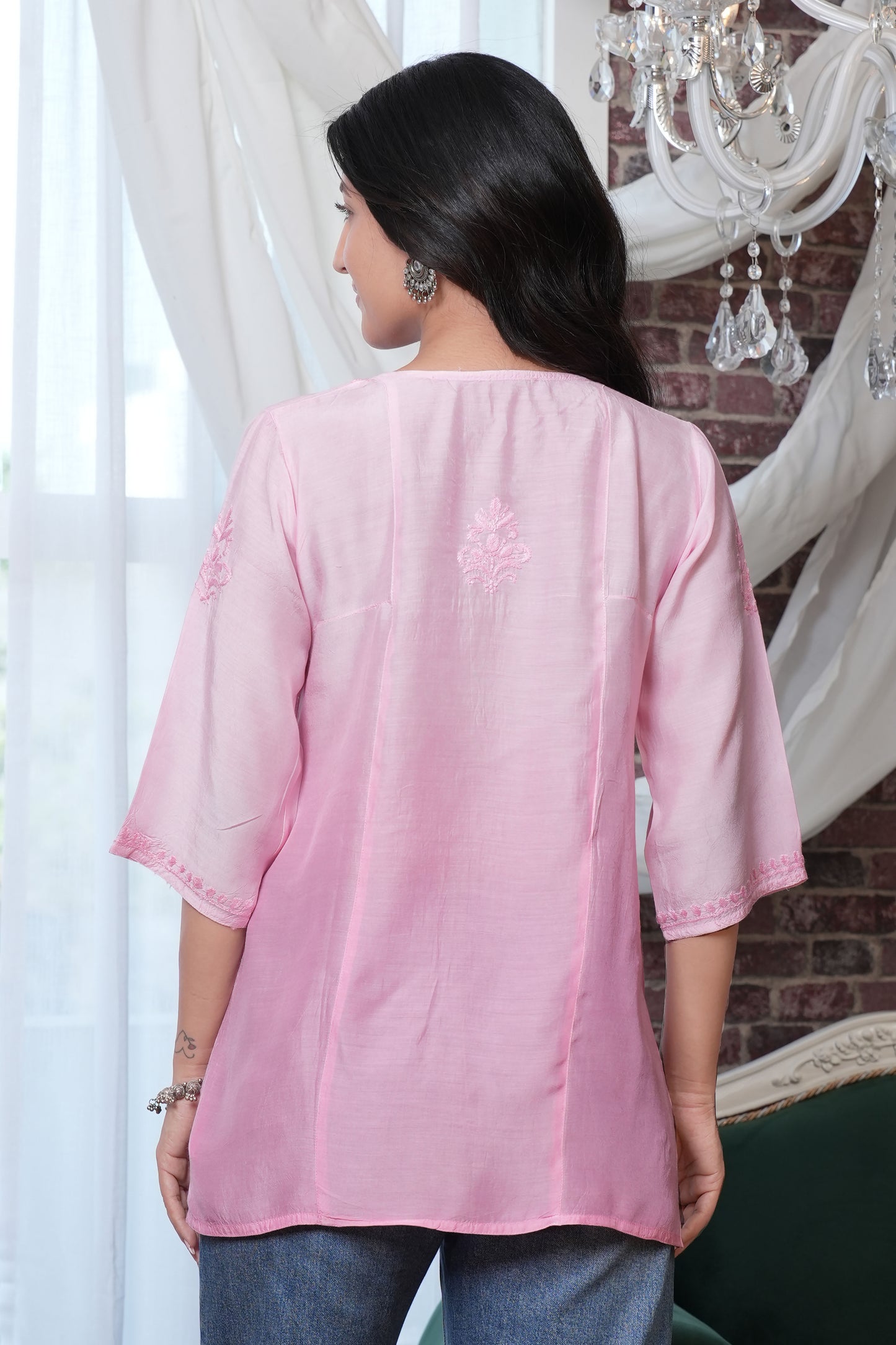 Intricate floral embroidery on front, back and sleeves.