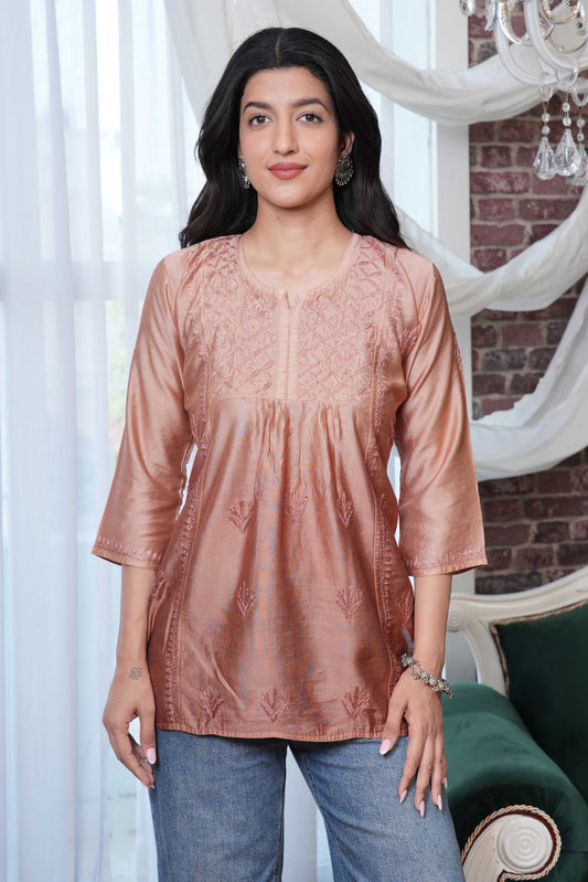 the intricate brown chikankari detailing enhances the kurta’s charm
