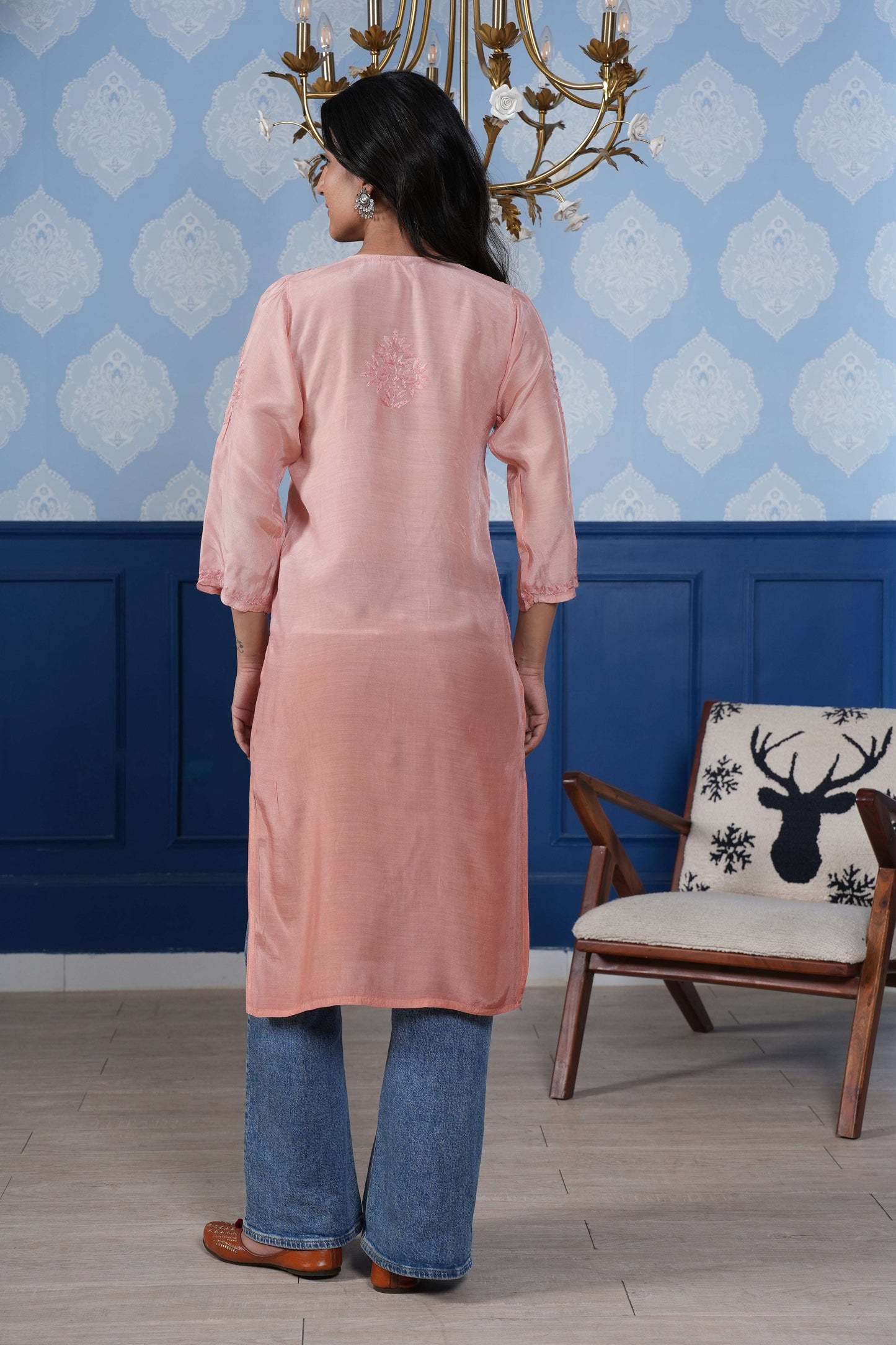 Intricate floral embroidery on front, back and sleeves.