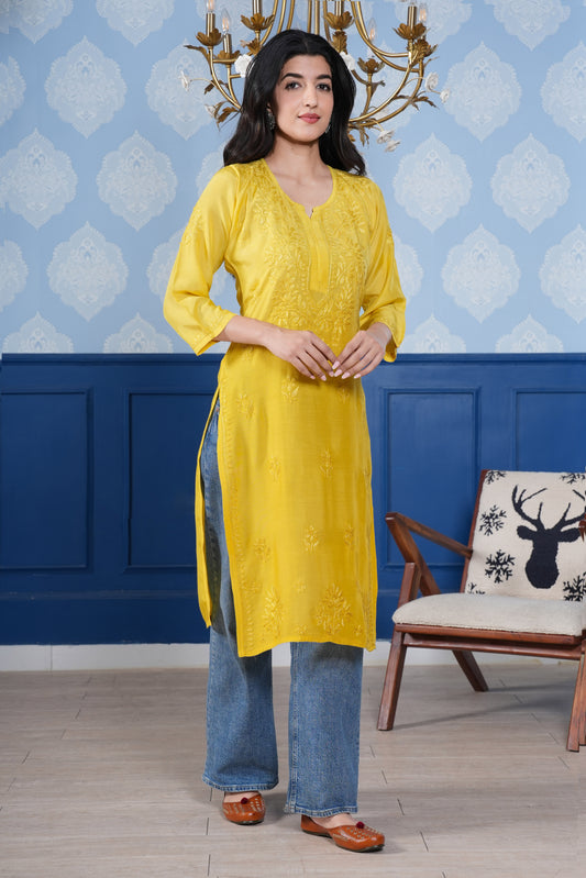 The intricate yellow chikankari detailing enhances the kurta’s charm