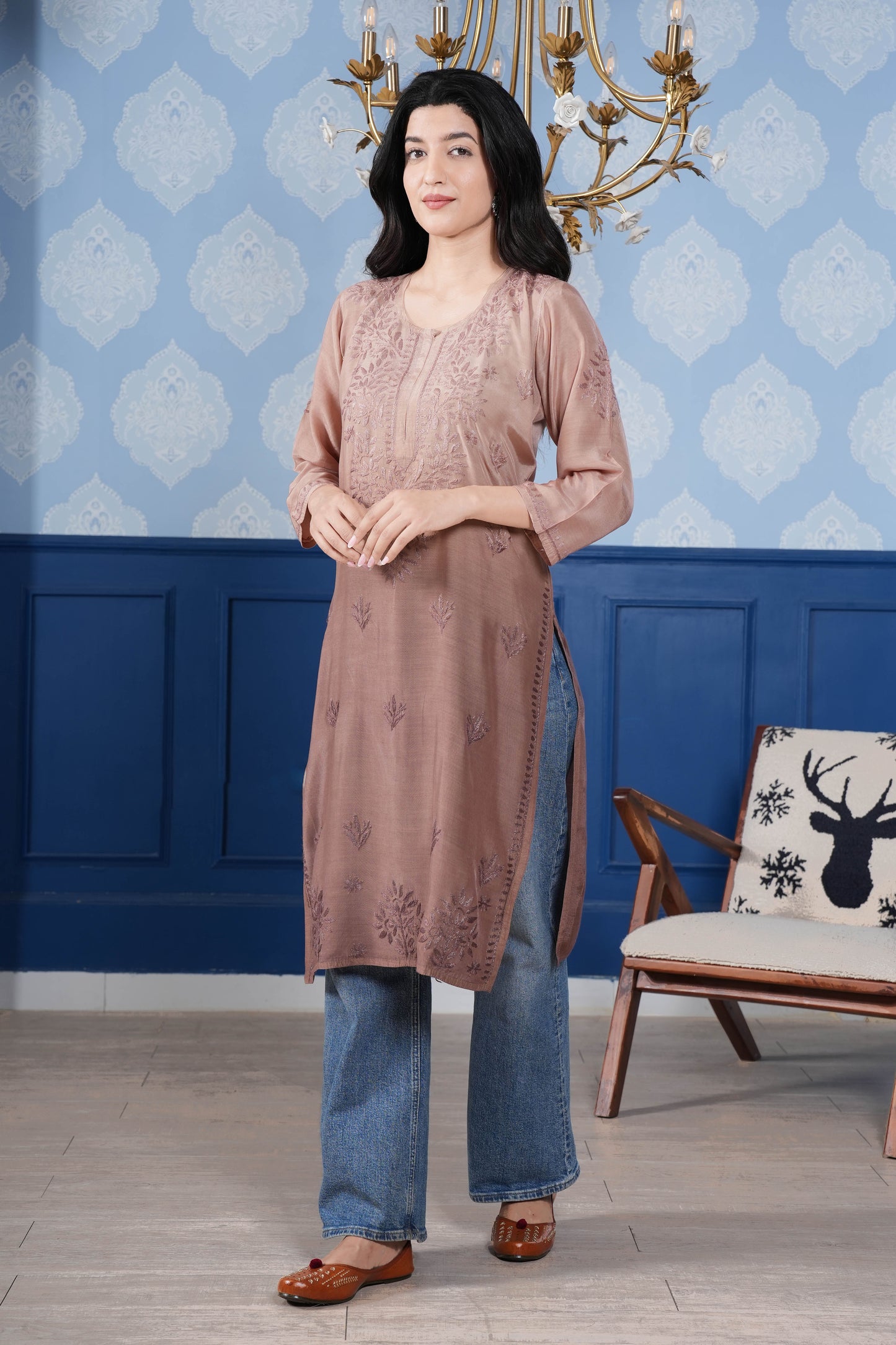 The intricate brown chikankari detailing enhances the kurta’s charm