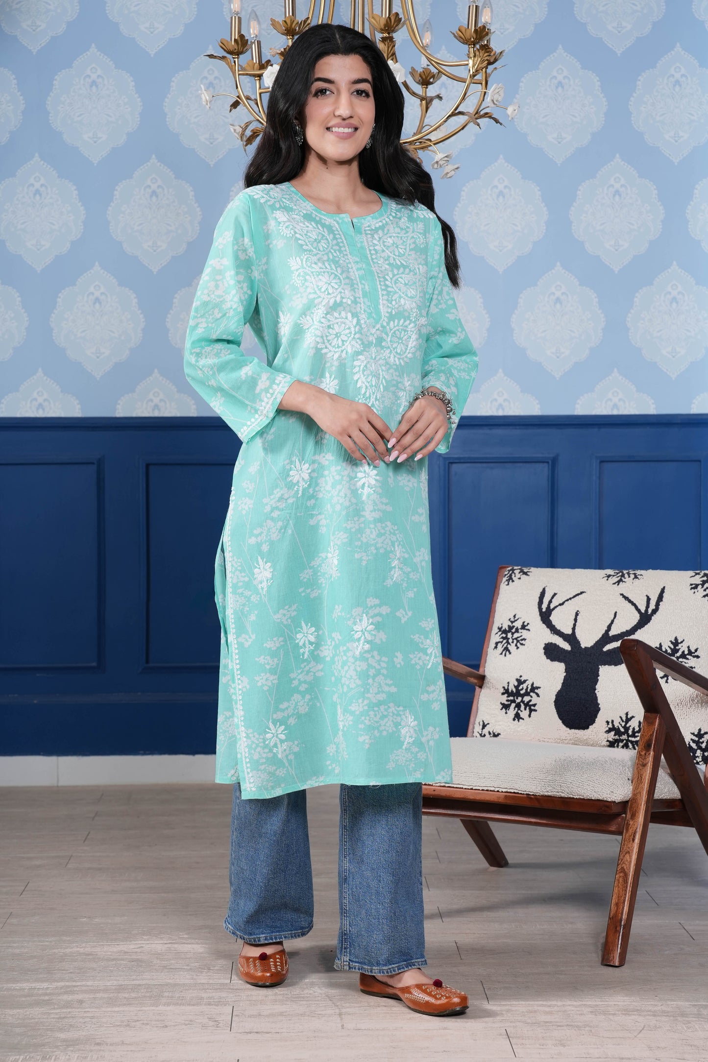 The intricate white chikankari detailing enhances the kurta’s charm