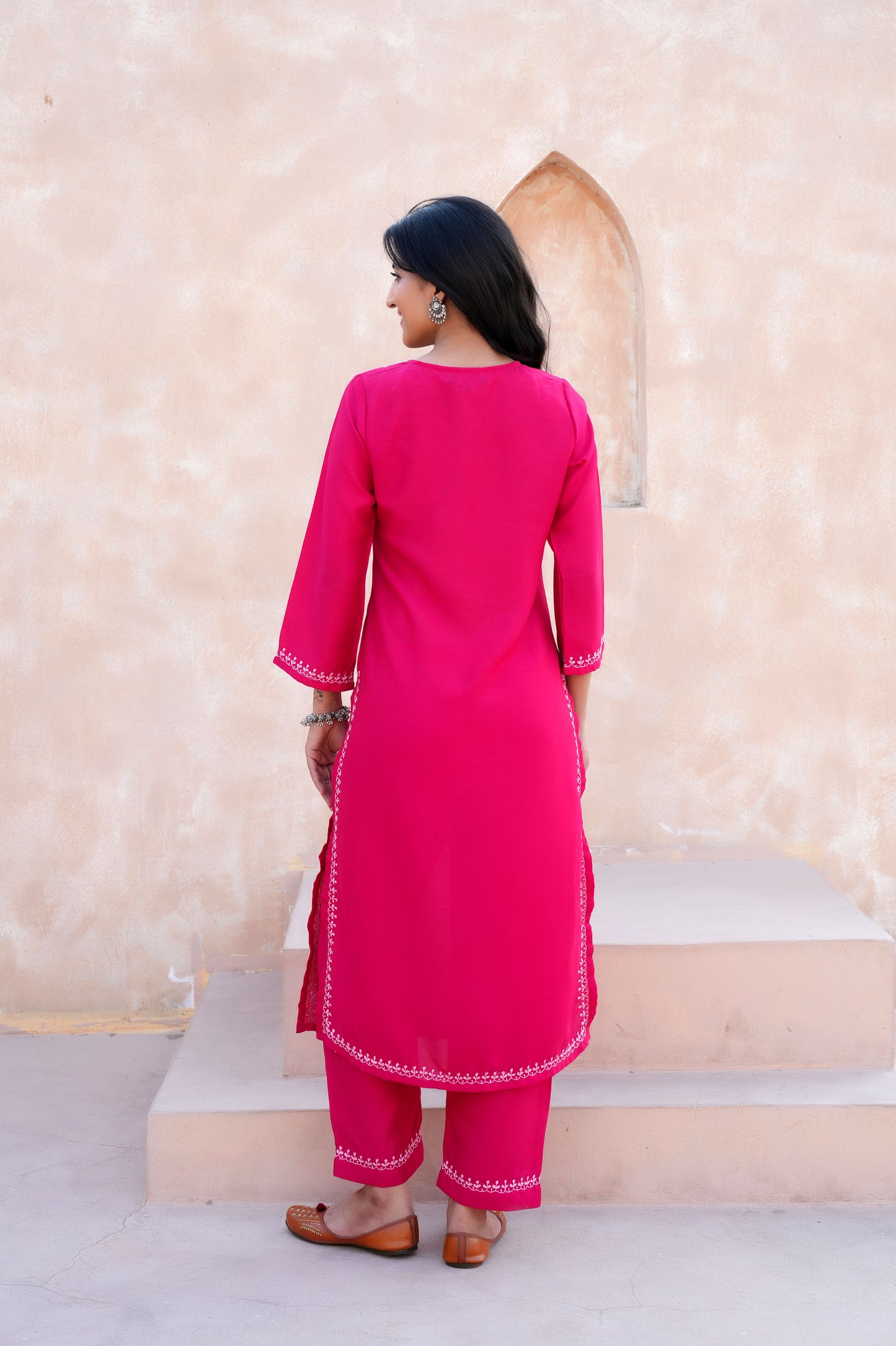 Intricate floral embroidery on front, back and sleeves