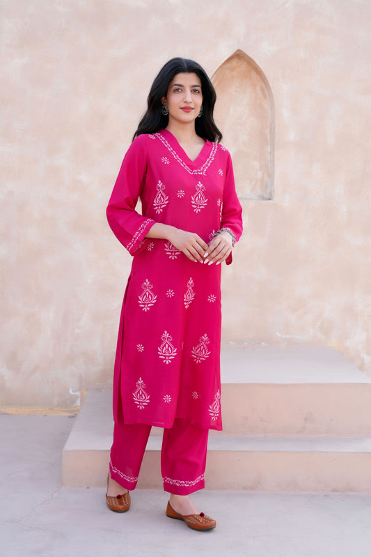 The intricate baby pink chikankari detailing enhances the kurta’s charm