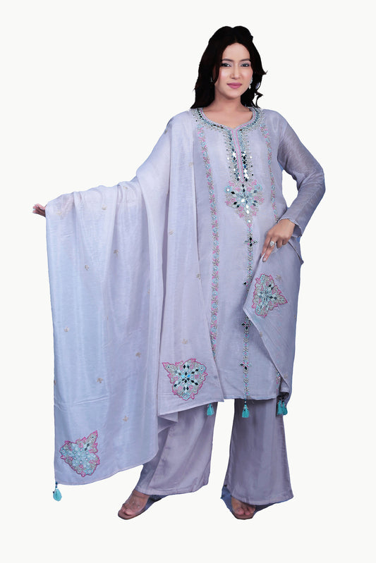 This suit set is designed with exclusive white pearl work that adds shimmer to a vibrant mirror work