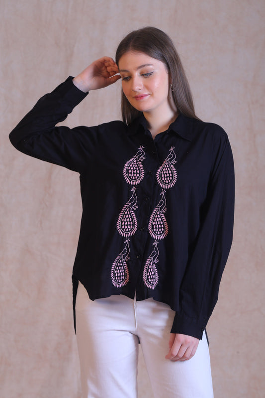 Featuring intricate pink embroidery with big paisley motifs.