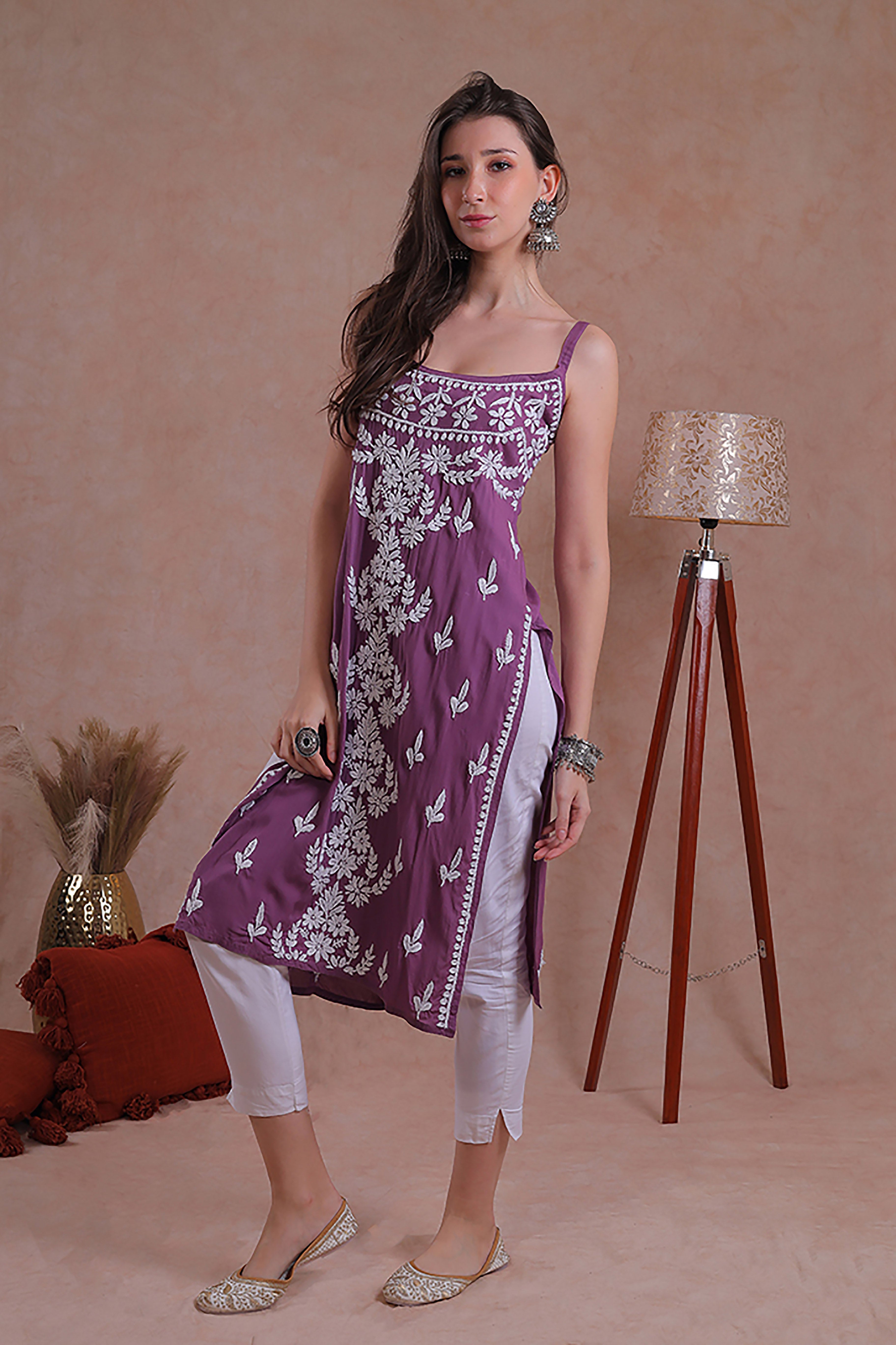 Delicate hand-embroidered Chikankari motifs grace the soft fabric.