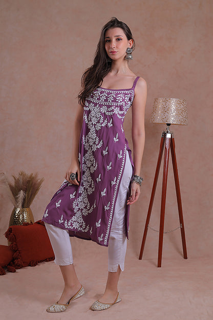 Delicate hand-embroidered Chikankari motifs grace the soft fabric.