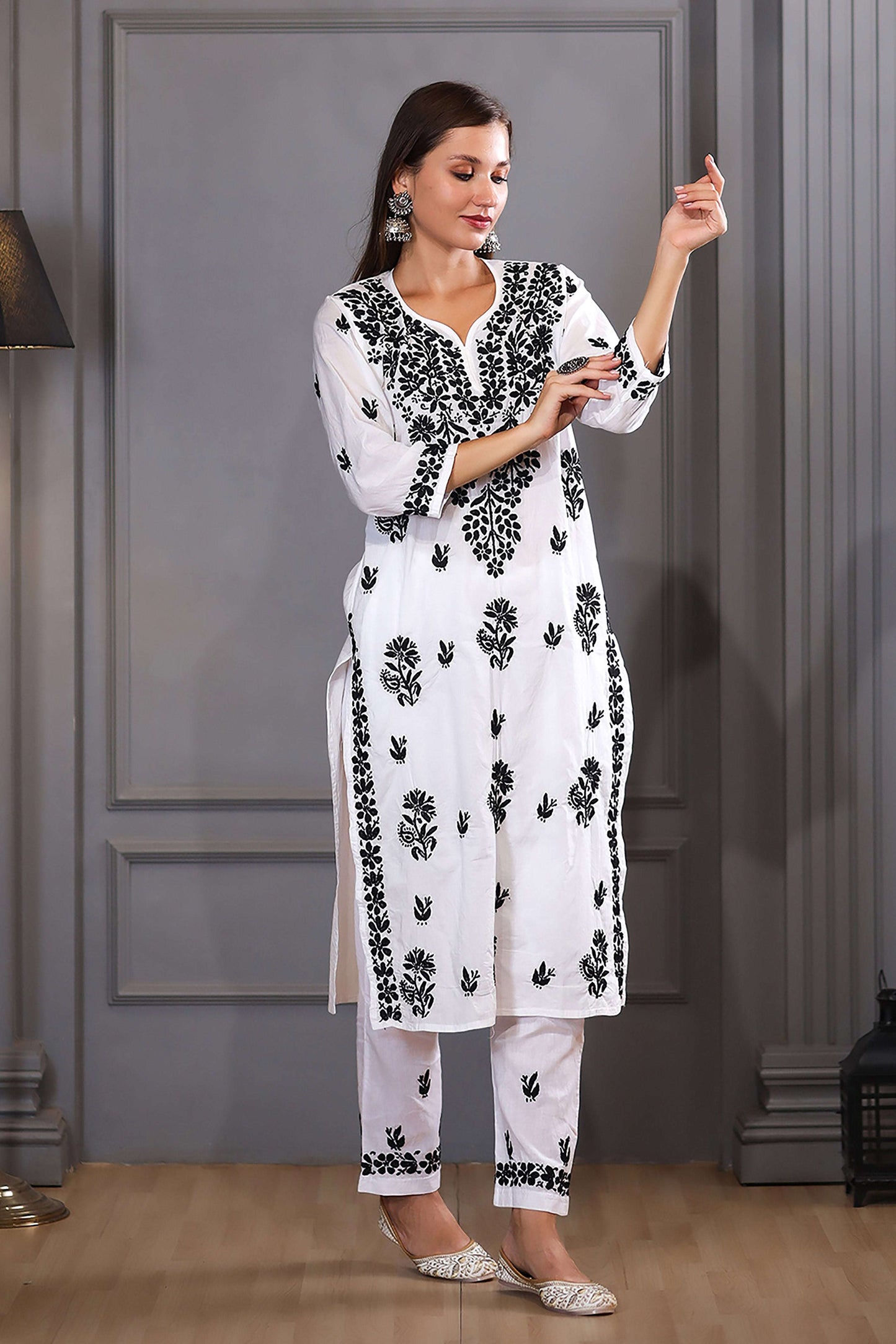 featuring intricate (ghaspatti) black thread embroidery