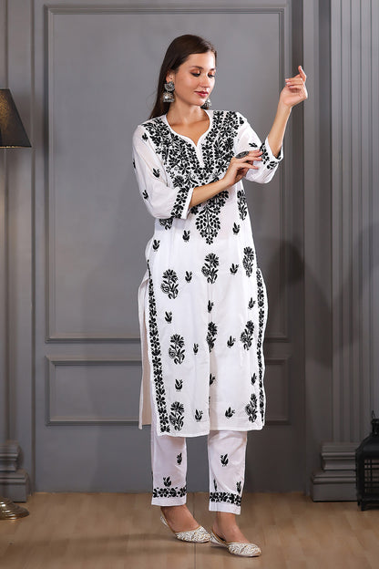 featuring intricate (ghaspatti) black thread embroidery