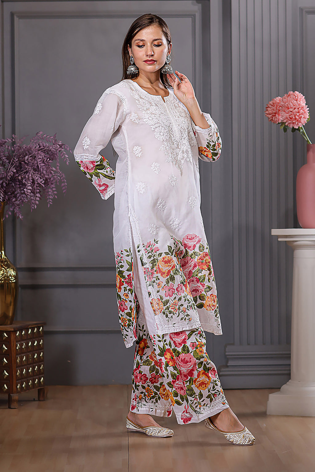 The floral designs adds a lively touch, while the delicate chikankari enhances the set’s grace.
