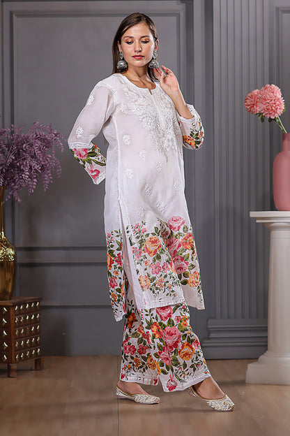 The floral designs adds a lively touch, while the delicate chikankari enhances the set’s grace.