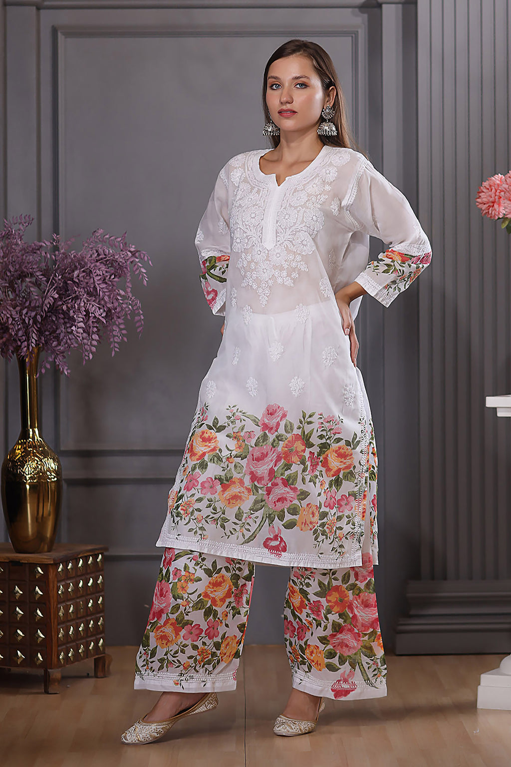 Adorned with exquisite chikankari embroidery with kashmiri neck design. 