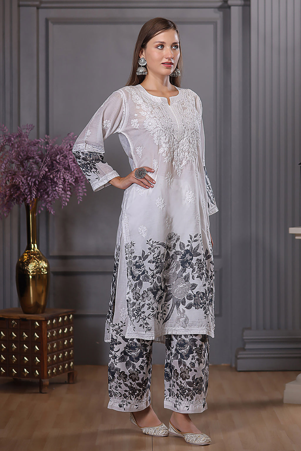 The floral designs adds a lively touch, while the delicate chikankari enhances the set’s grace.
