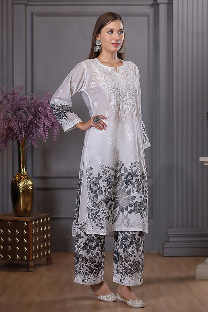 The floral designs adds a lively touch, while the delicate chikankari enhances the set’s grace.