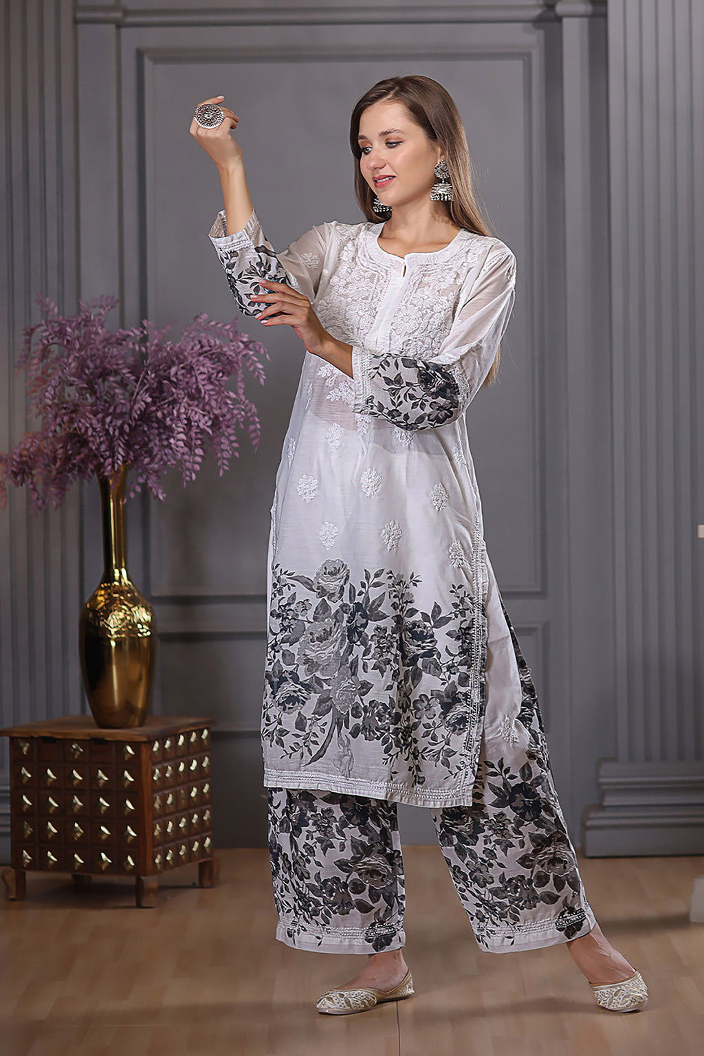 The floral design and chikankari detailing add elegance.  