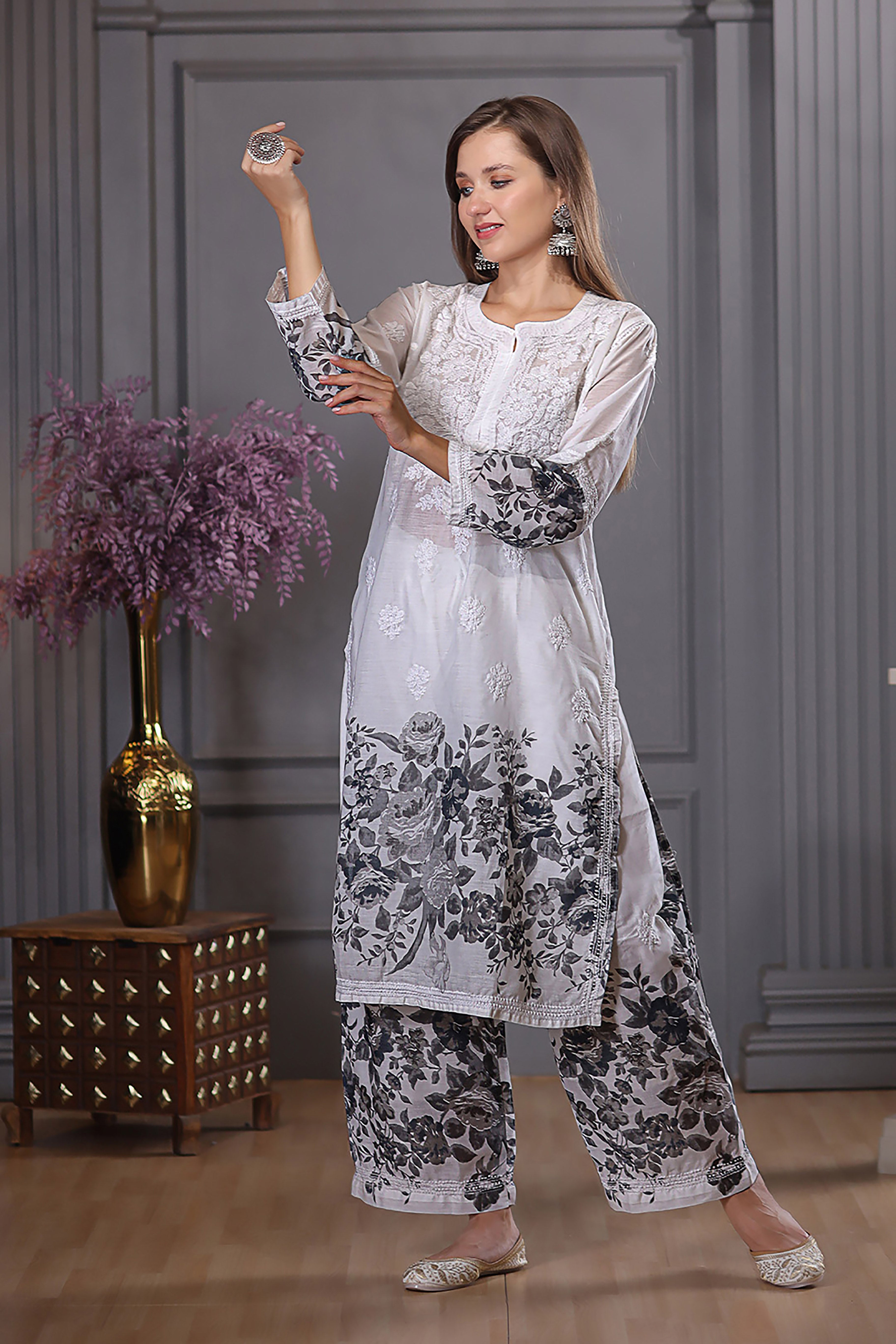 The floral design and chikankari detailing add elegance.  