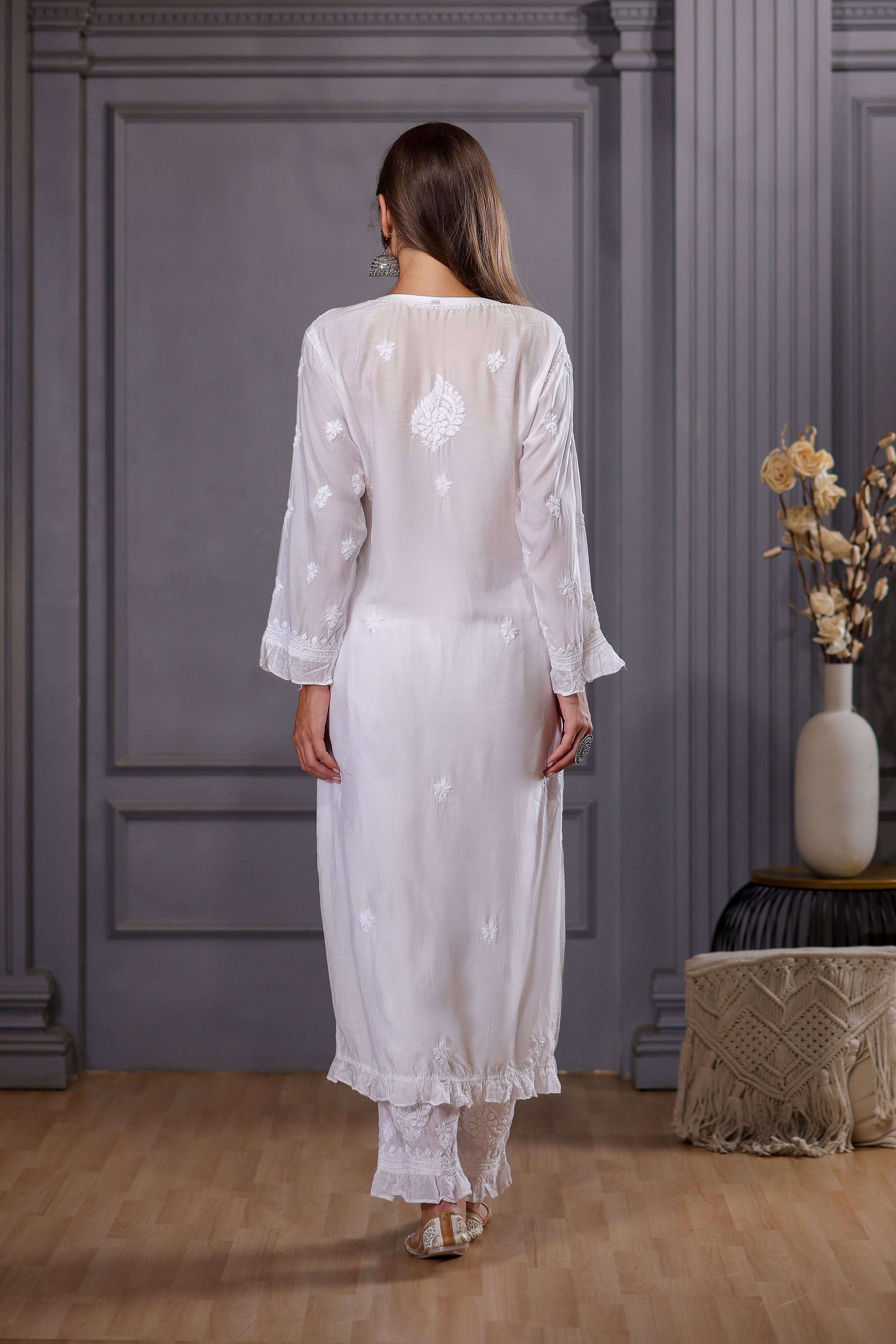 floral embroidery on front, back and sleeves.