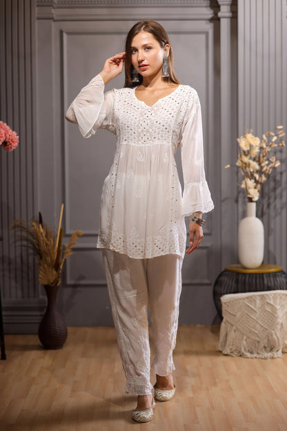 This white coloured Kurta features an angrakha design on a short Kurta. 