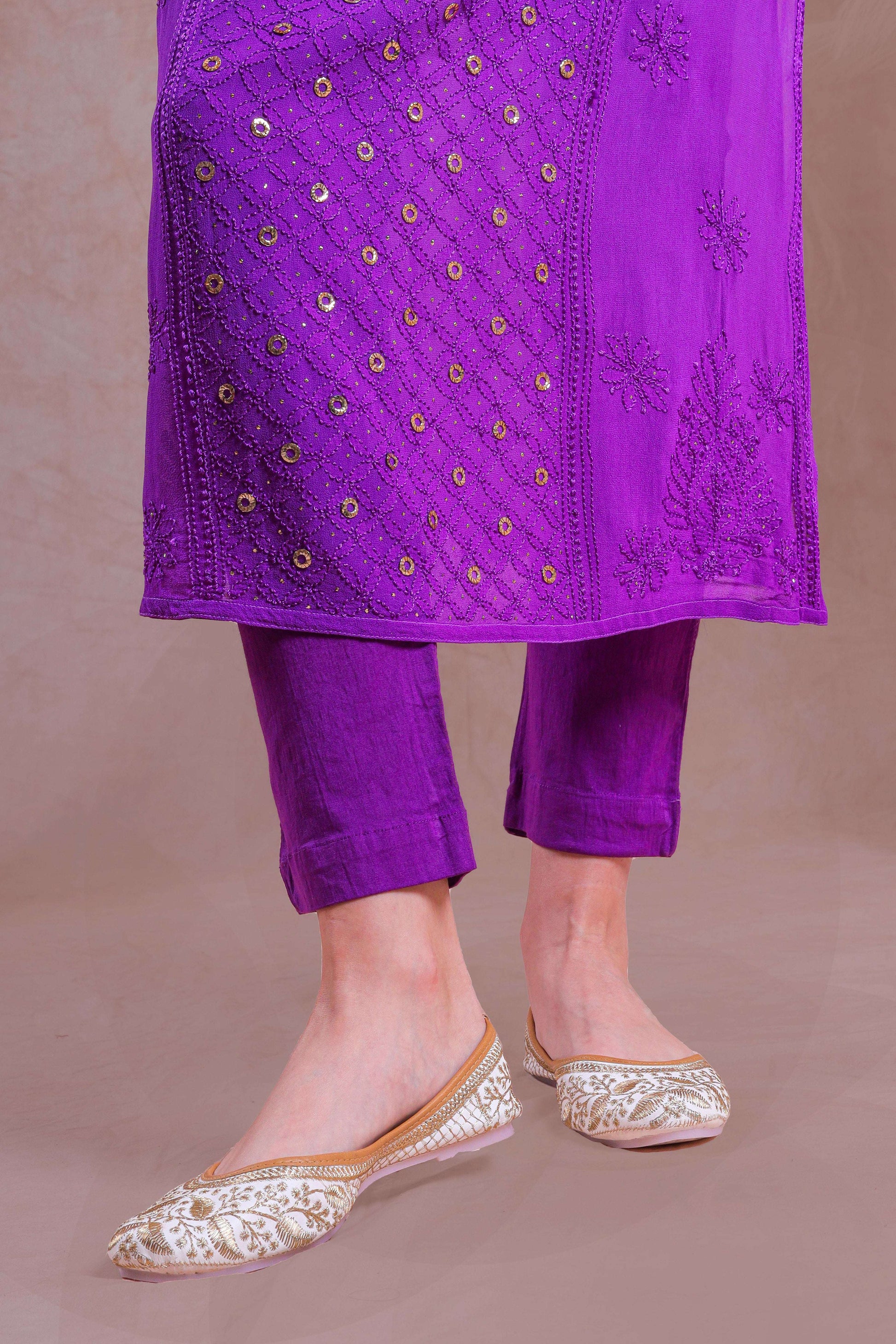 Handcrafted embroidery adds a unique and sophisticated touch.