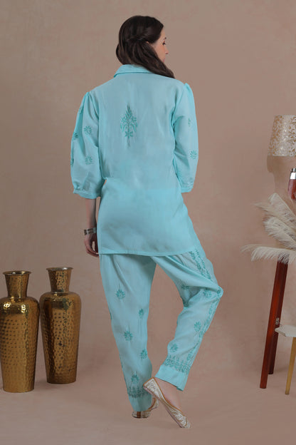 Intricate floral embroidery on front, back and sleeves.