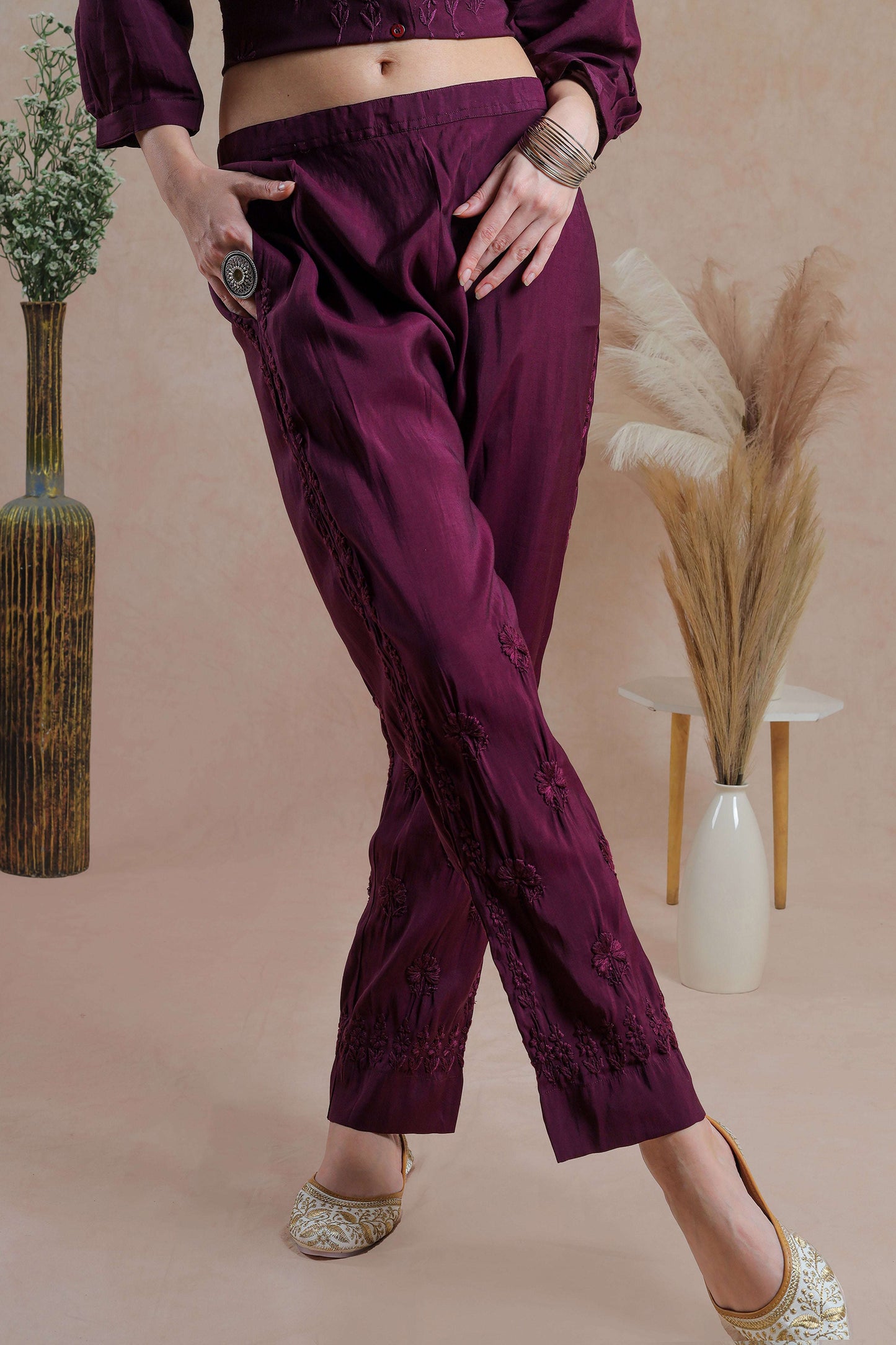 Intricate floral embroidery on front, back and sleeves.