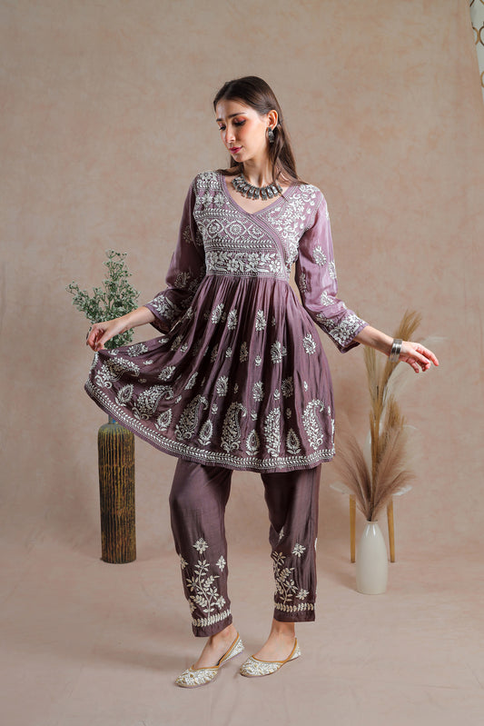 This Muslin asymmetrical yoke frock style kurta with pant.