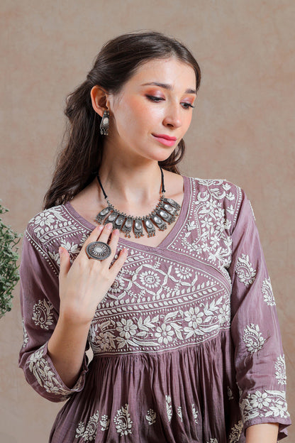 The asymmetricel yoke design adds a contemporary twist.