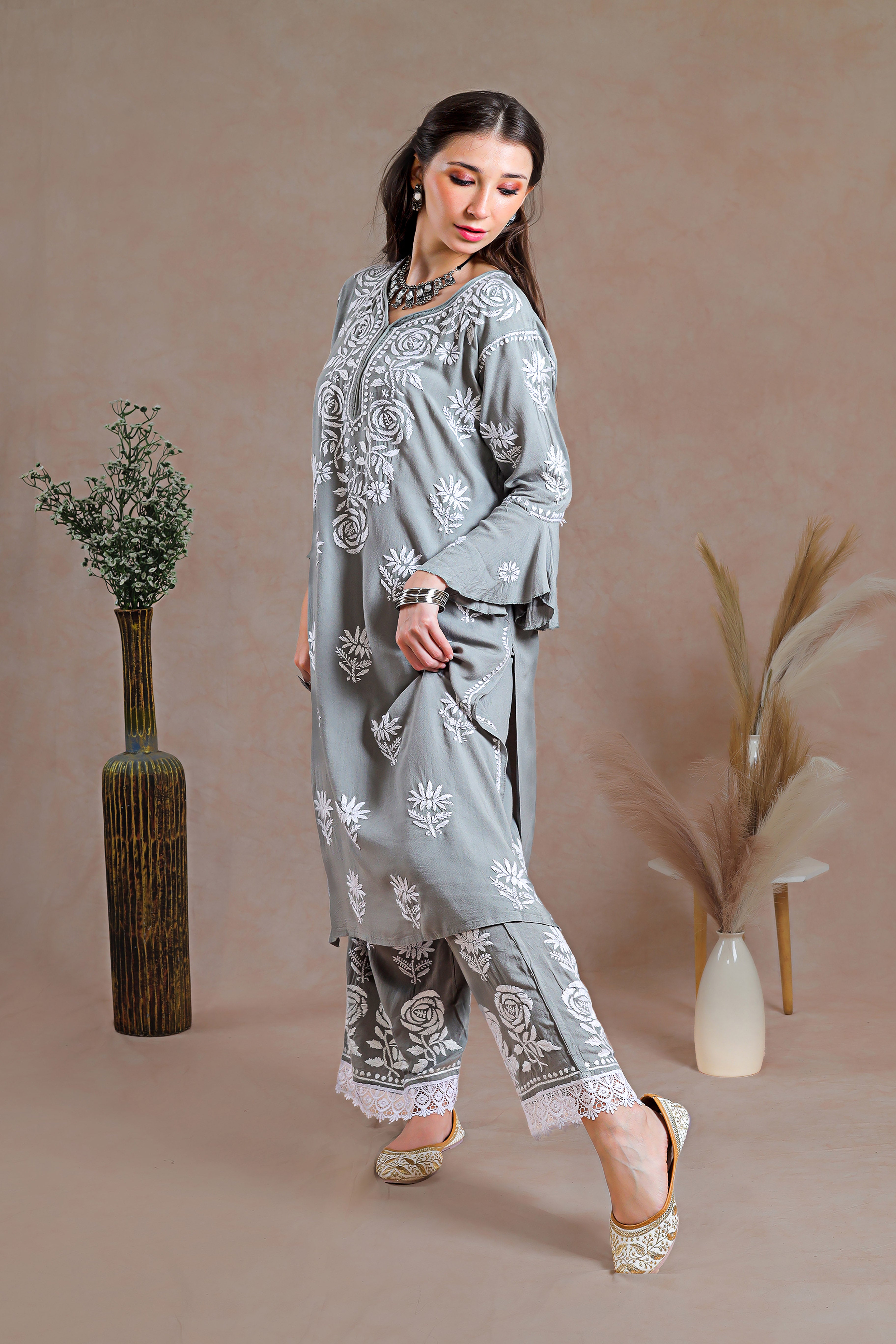 Ensemble adorned with intricate hand-embroidered Chikankari motifs.  