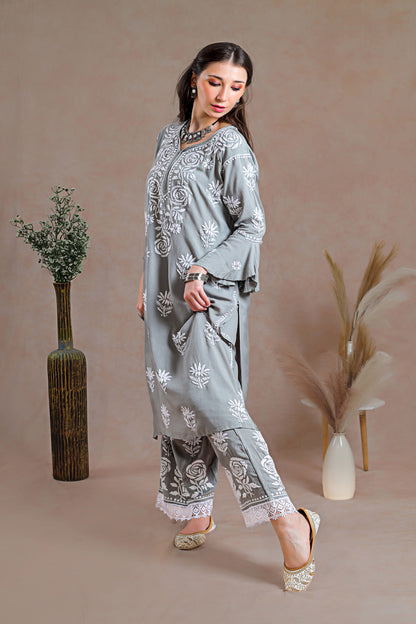 Ensemble adorned with intricate hand-embroidered Chikankari motifs.  