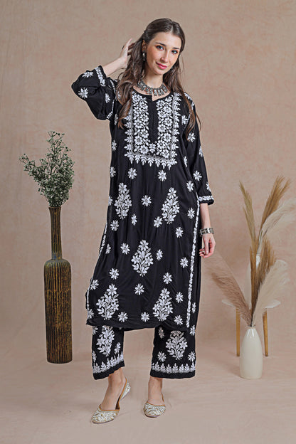Chikankari black kurta set, a classic ensemble adorned with intricate hand-embroidered Chikankari motifs. 
