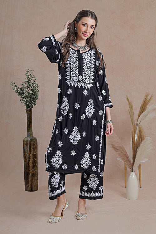 Chikankari black kurta set, a classic ensemble adorned with intricate hand-embroidered Chikankari motifs. 