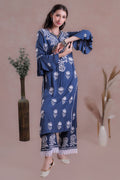 The rich blue shade enhances the delicate embroidery.