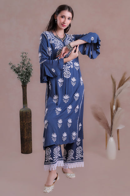 The rich blue shade enhances the delicate embroidery.