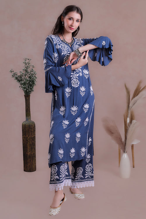The rich blue shade enhances the delicate embroidery.