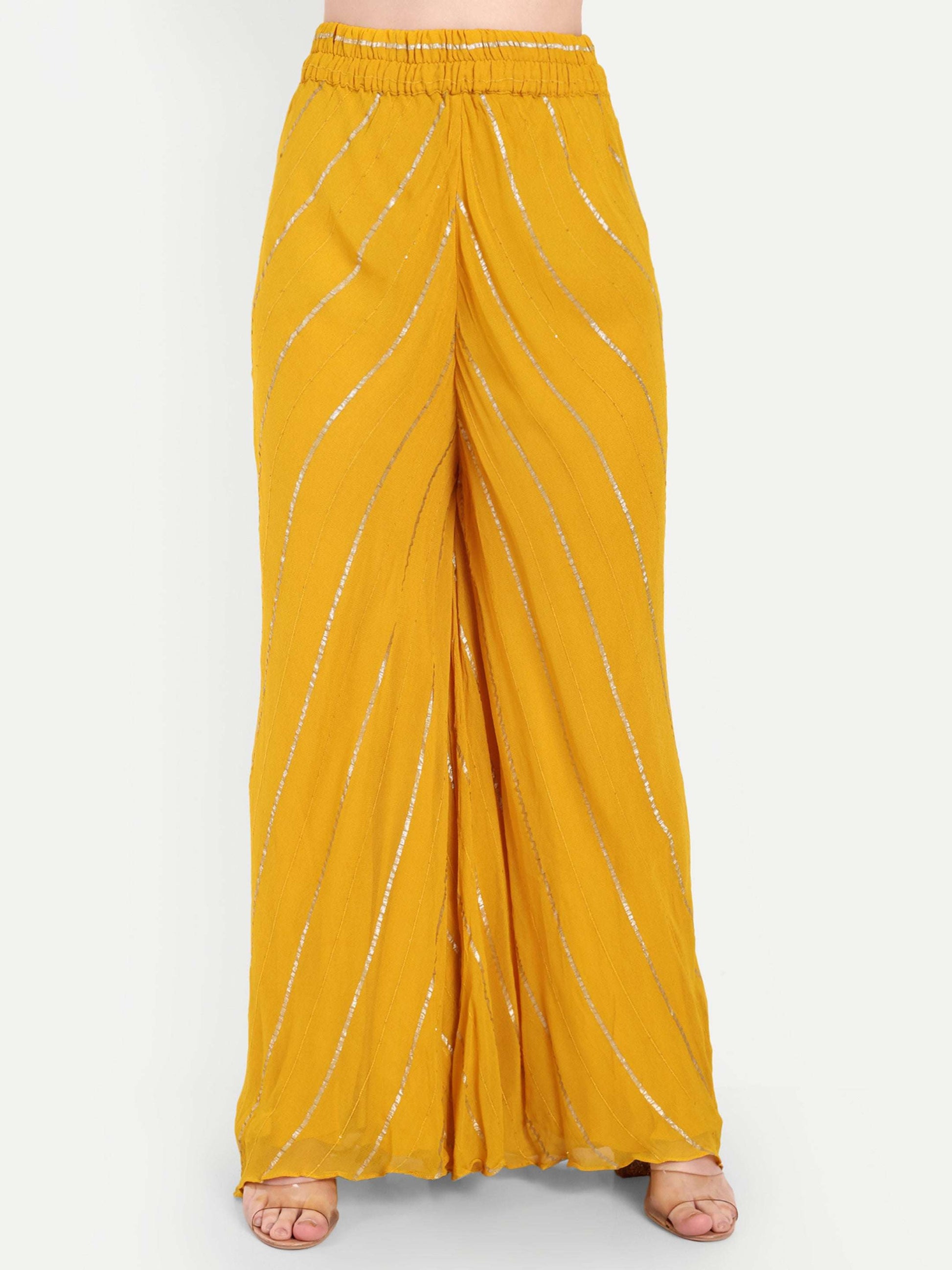 Yellow sharara intricate with golden design