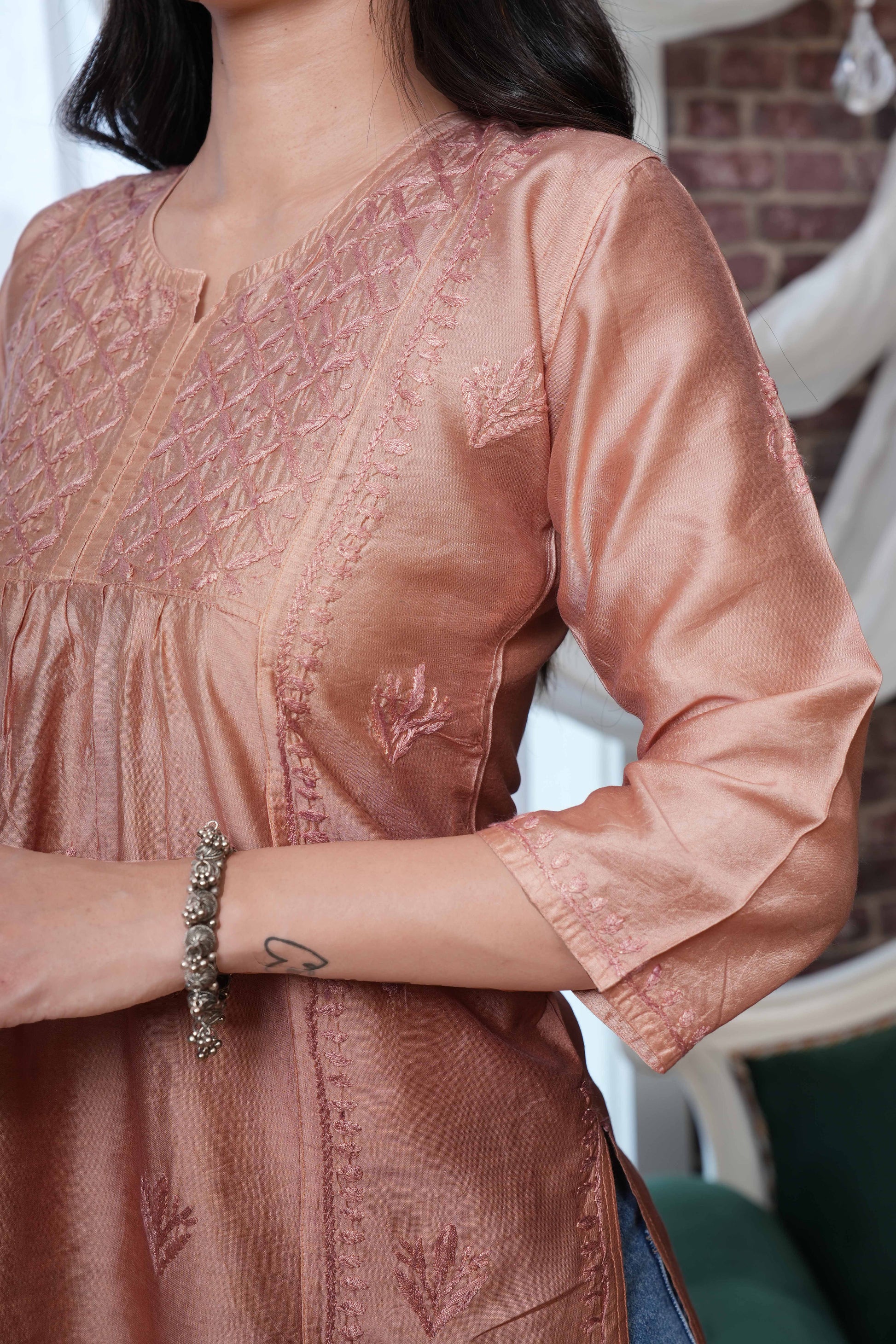 The asymmetricel yoke design adds a contemporary twist.