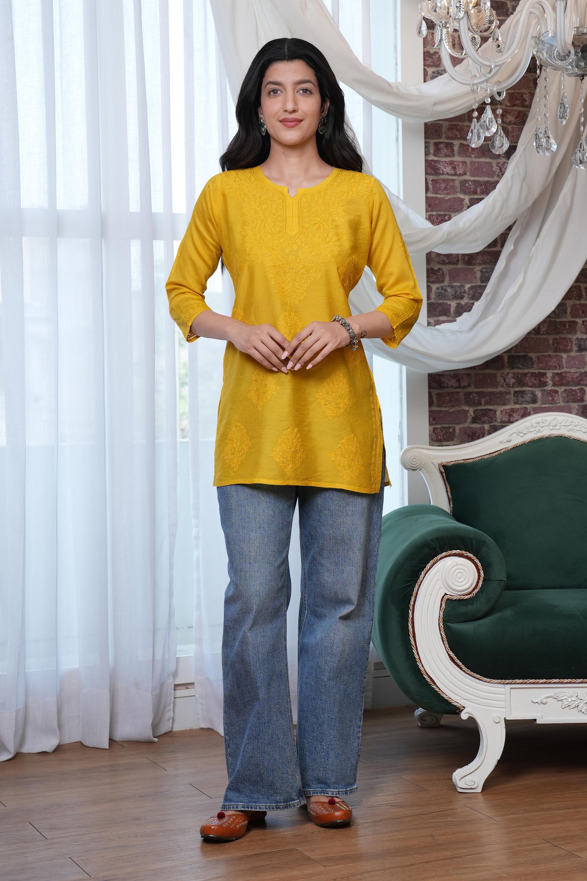 this short kurta intricate yellow chikankari detailing that enhances the kurta’s charm
