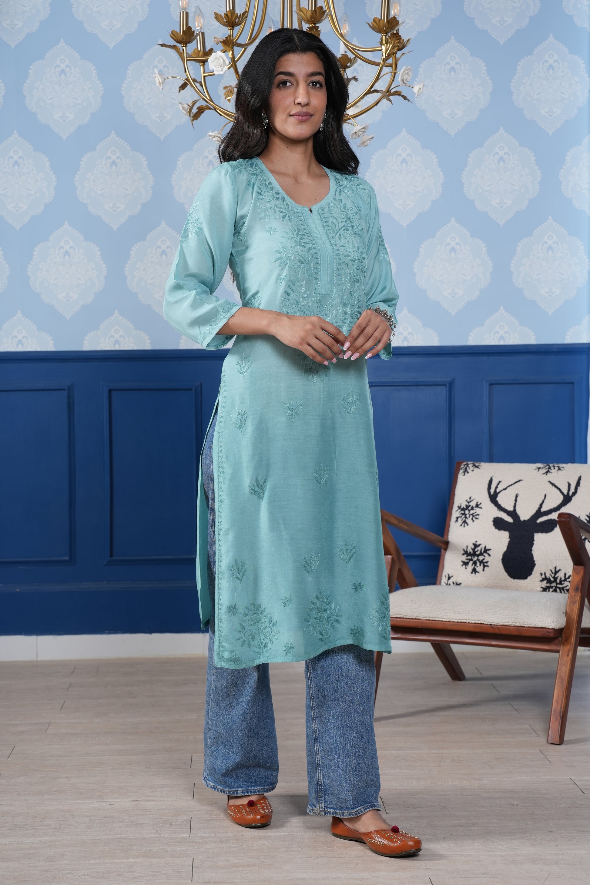 The intricate blue chikankari detailing enhances the kurta’s charm