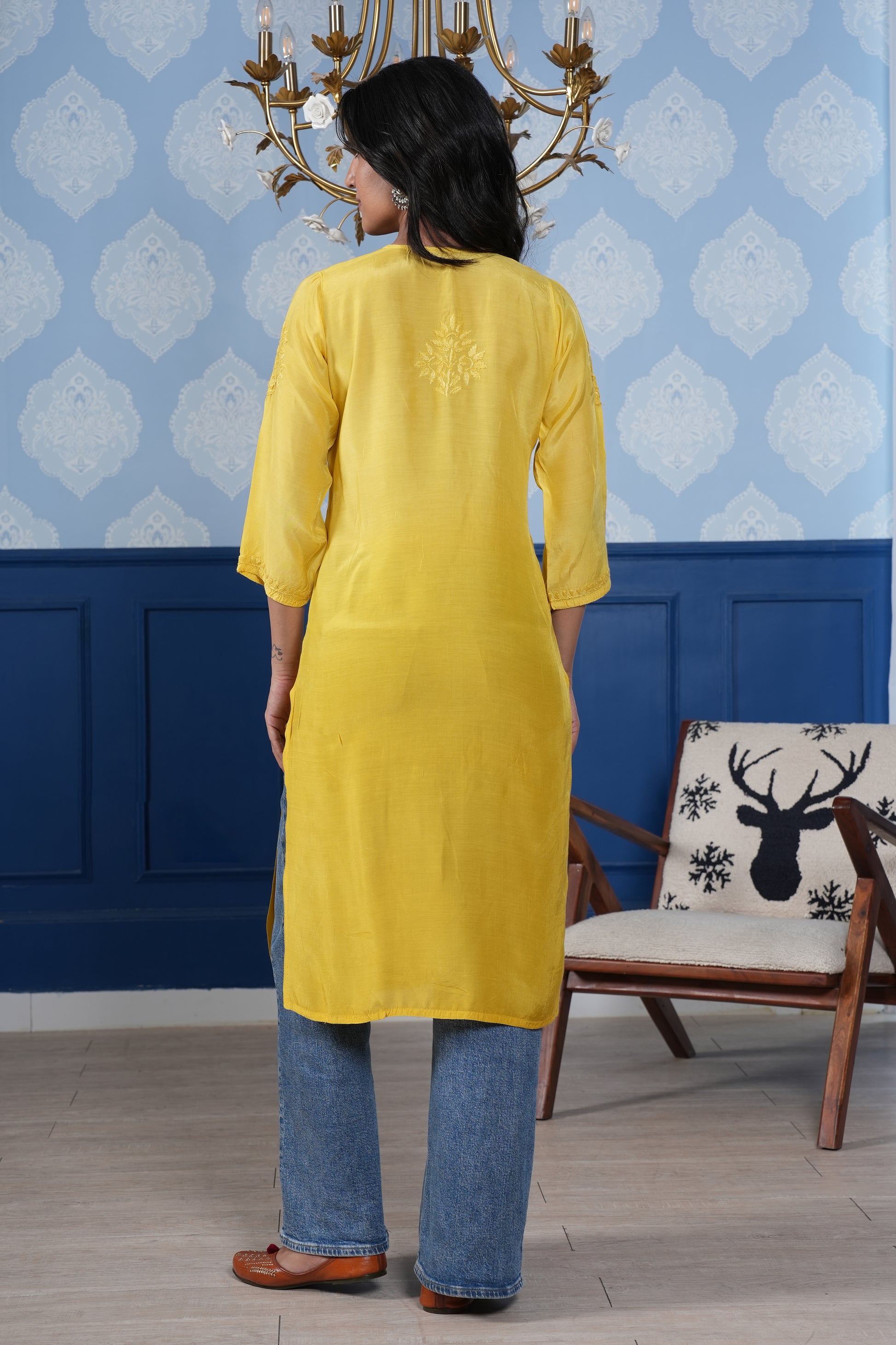 Intricate floral embroidery on front, back and sleeves.