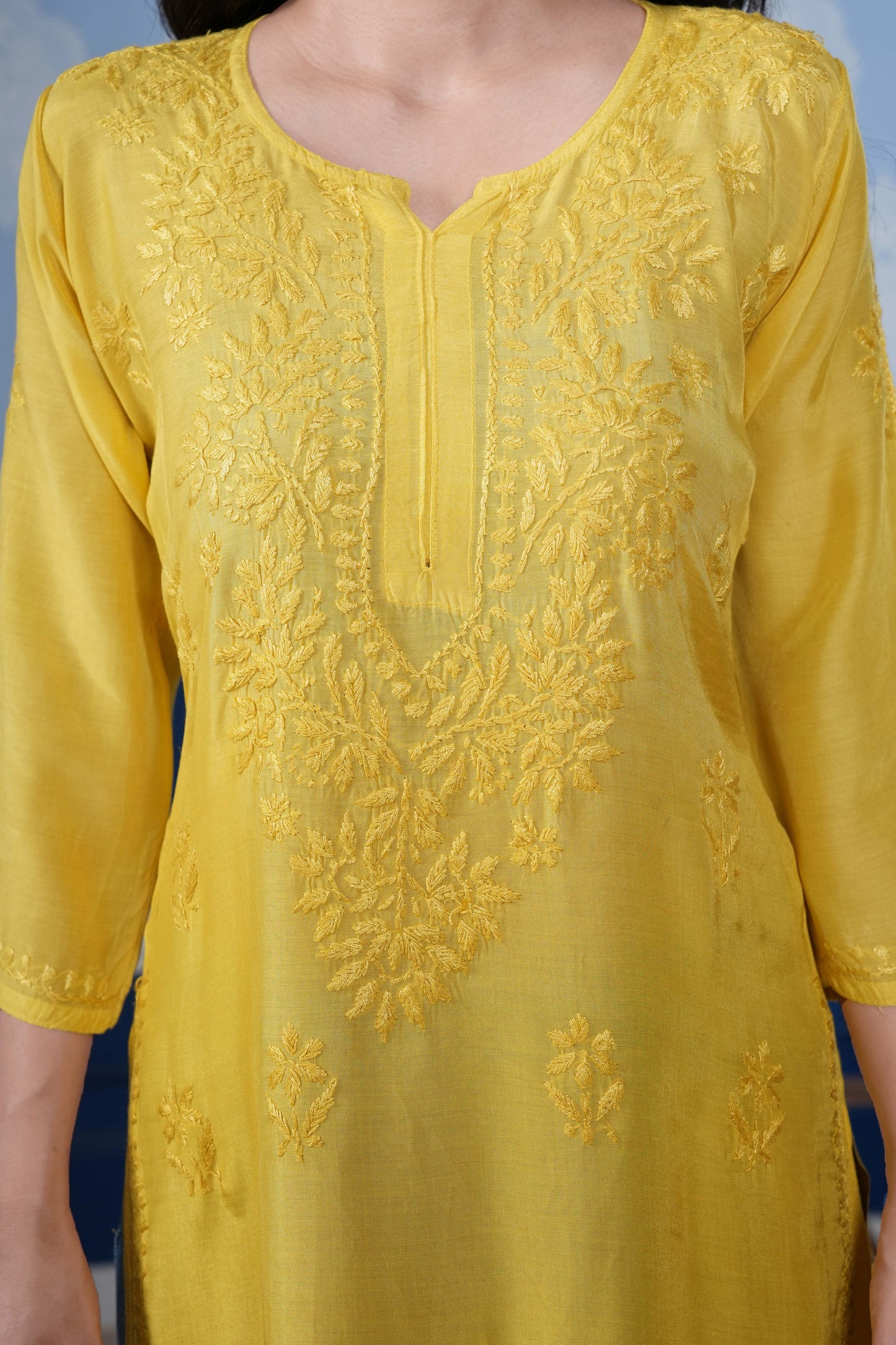 The asymmetrical yoke design adds a contemporary twist.