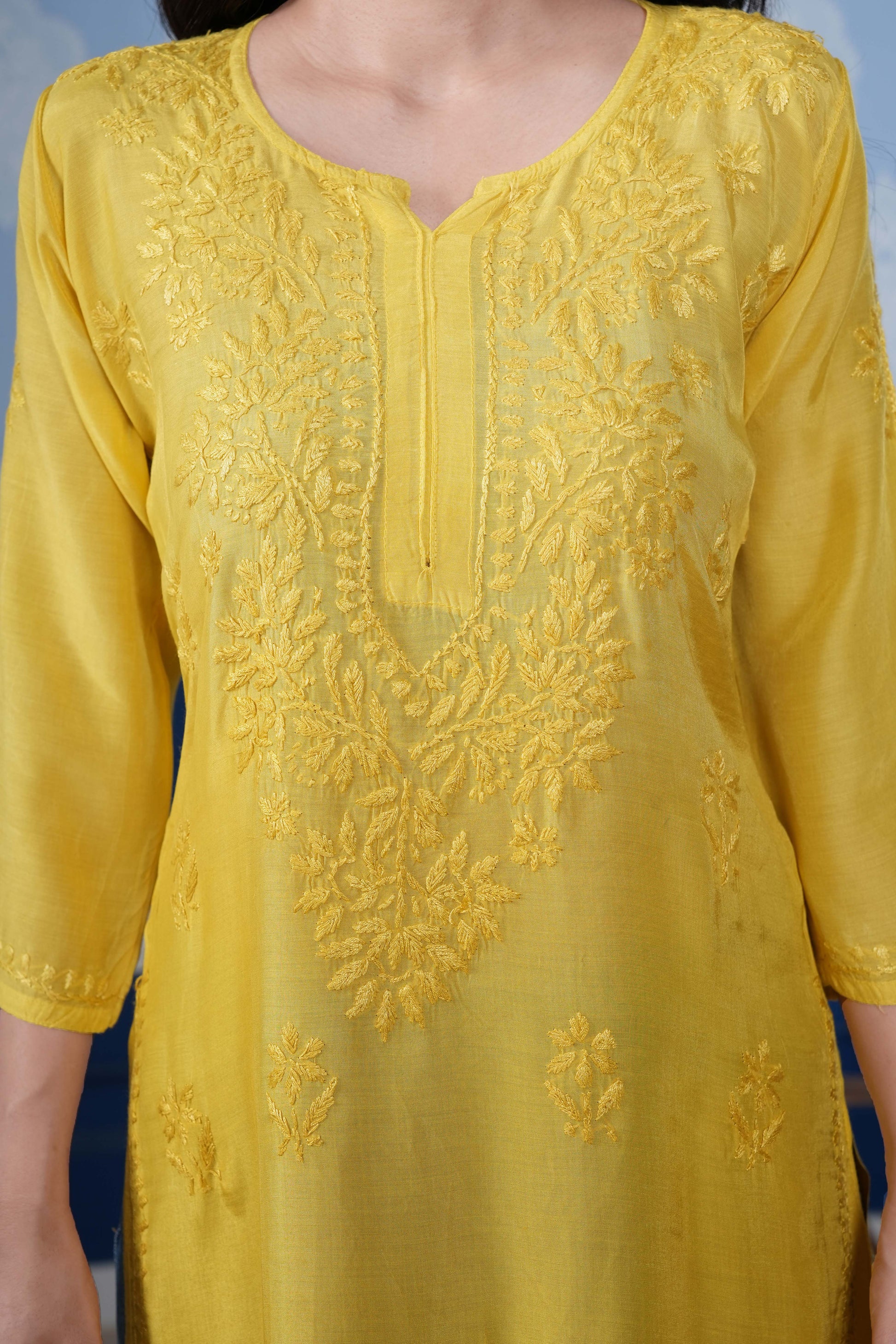 The asymmetrical yoke design adds a contemporary twist.