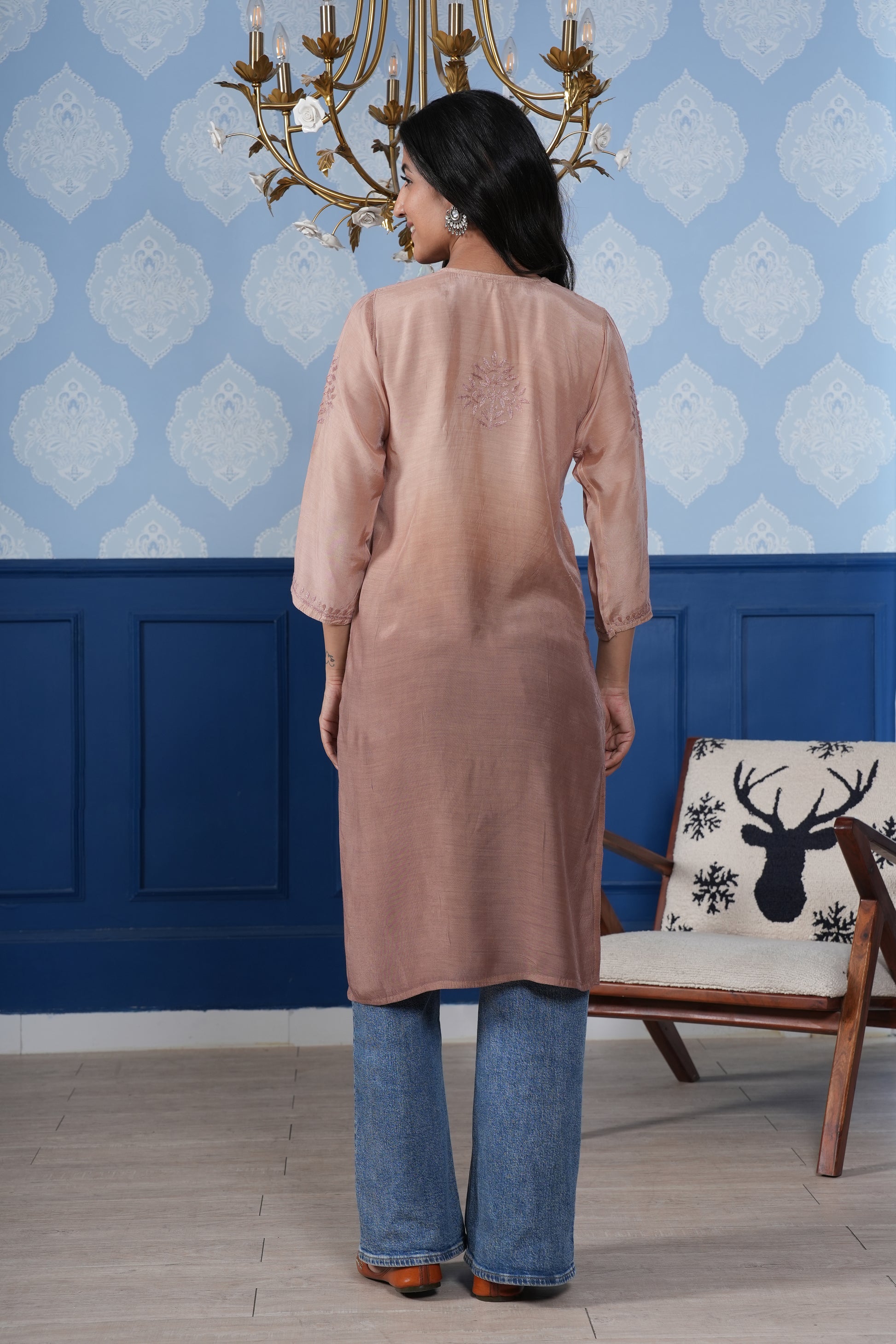 Intricate floral embroidery on front, back and sleeves.
