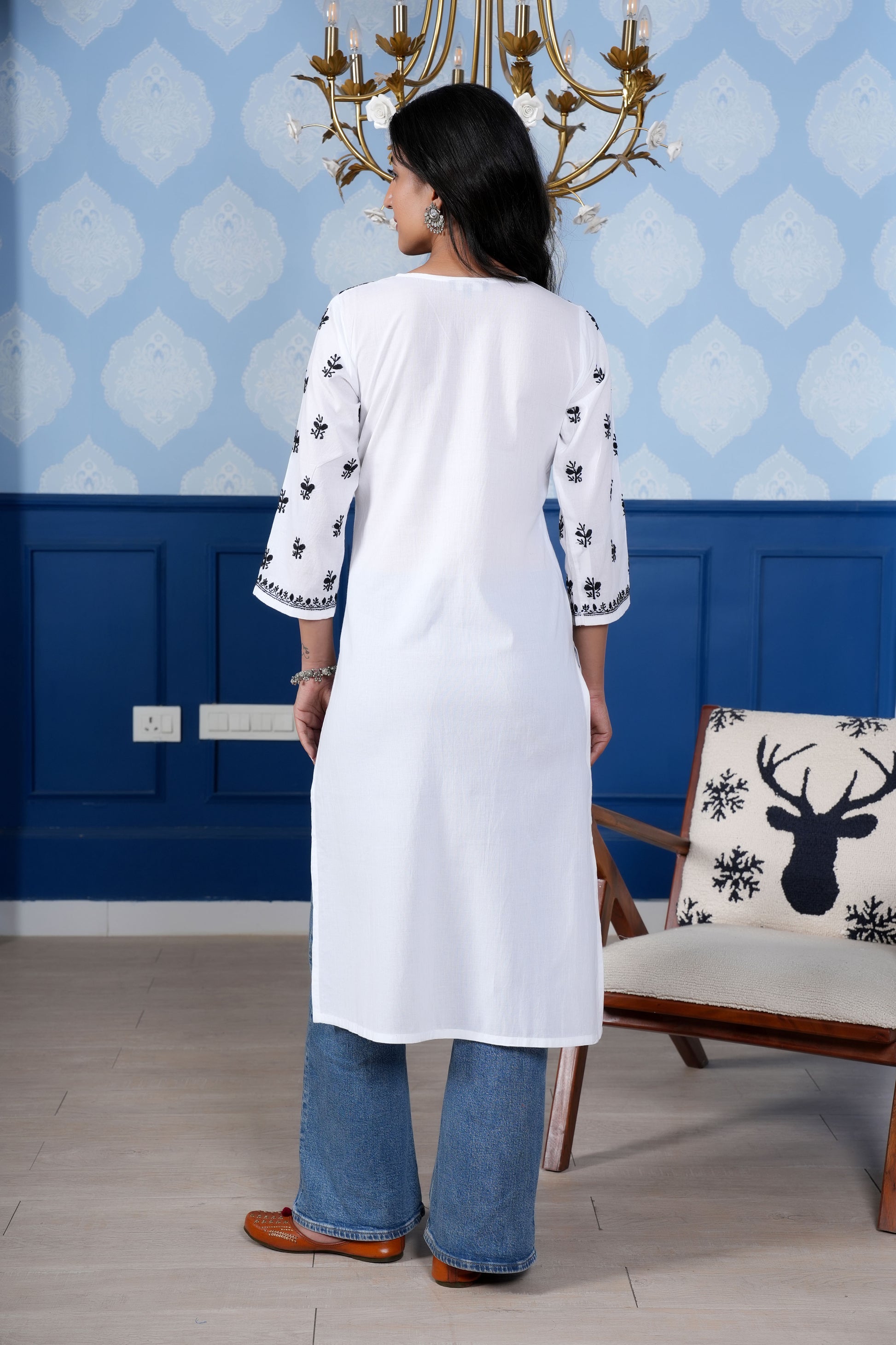 Intricate floral embroidery on front and sleeves.