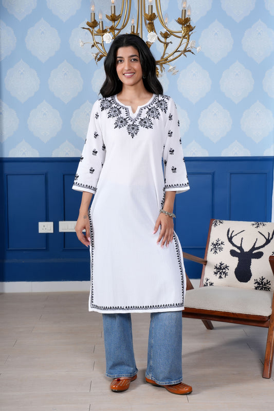 White kurta set intricate with black chikankari  