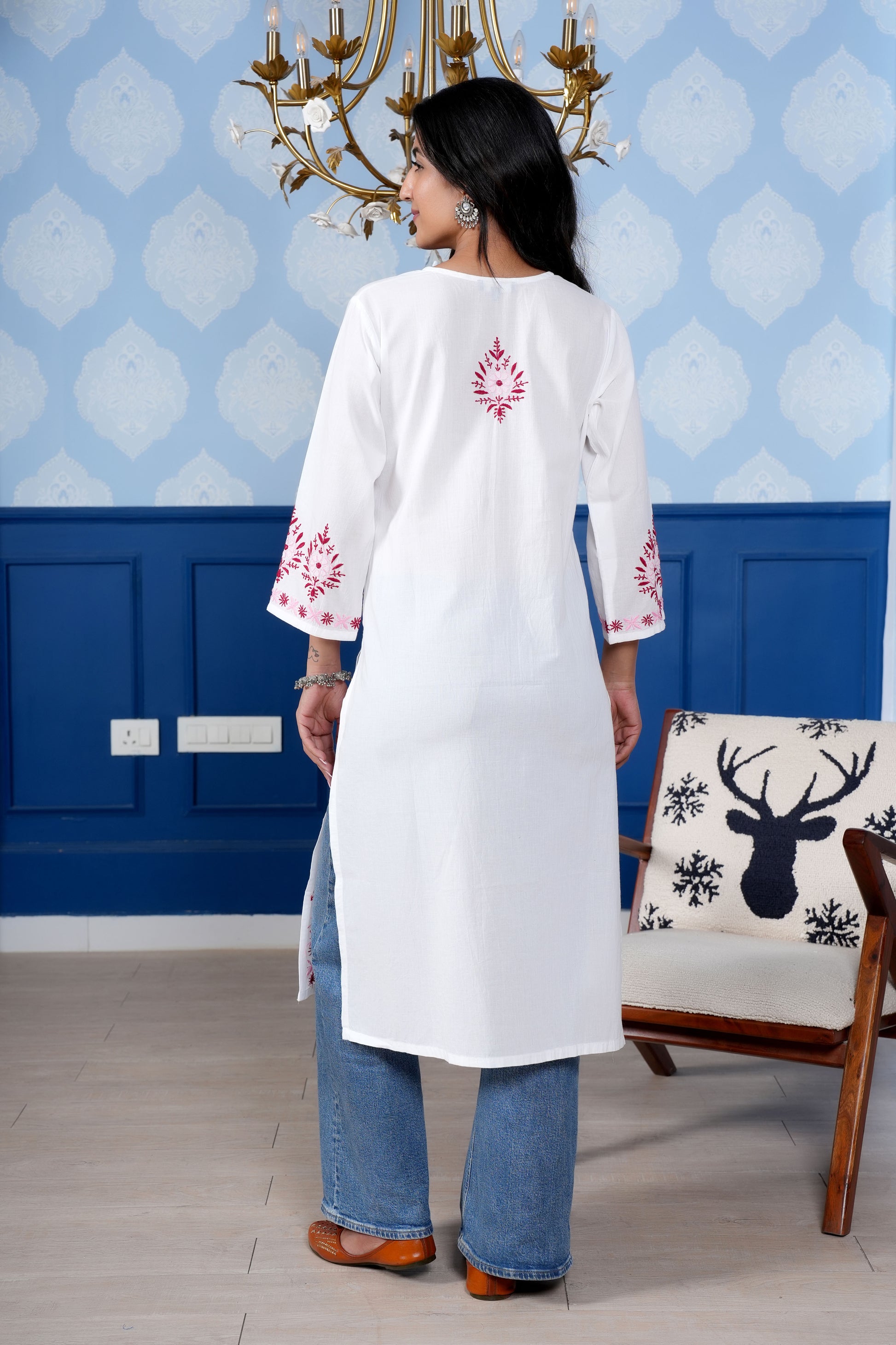 Intricate floral embroidery on front, back and sleeves.
