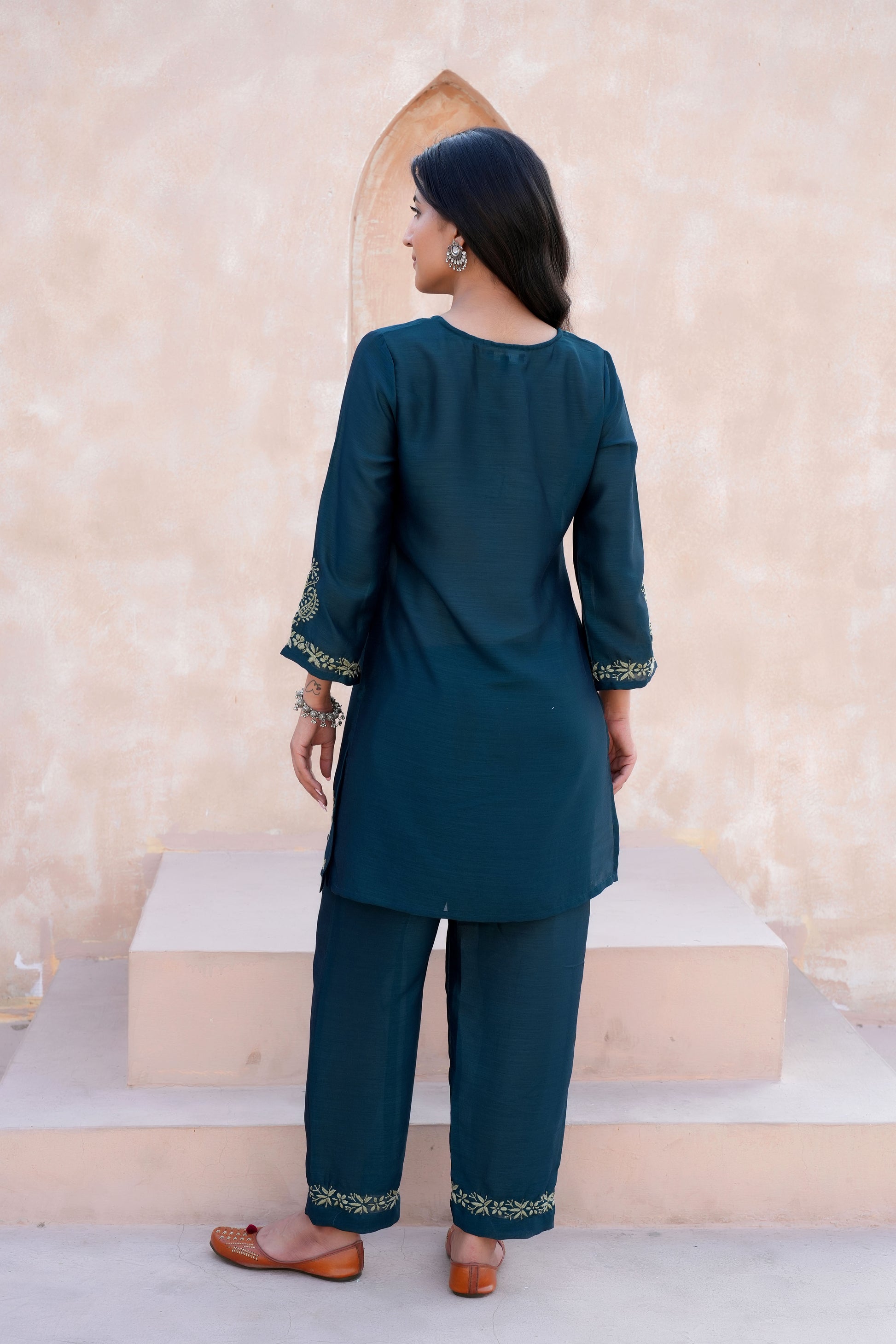 Intricate floral embroidery on front, back and sleeves