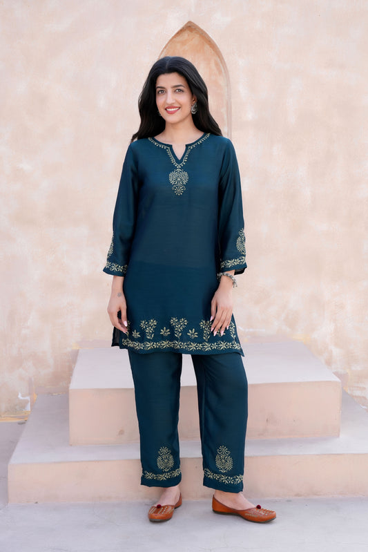 This Poly Silk Chikankari kurta set offers a perfect blend of modern style and traditional charm. 